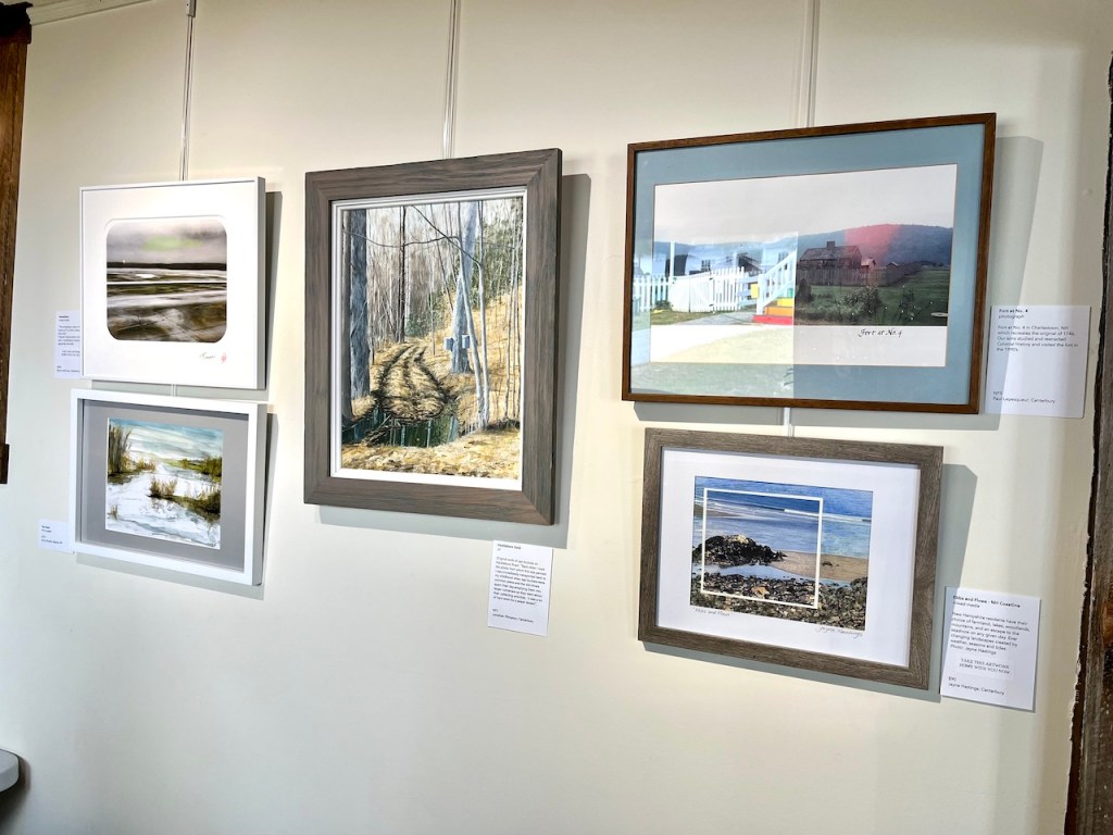 Art gallery wall featuring various framed artworks, including landscapes and abstract pieces. Descriptions of each artwork are visible beside the frames.