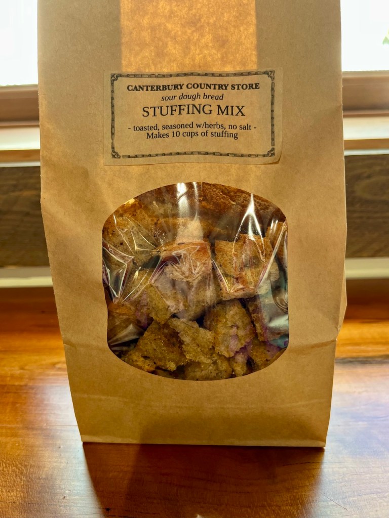 A package of sourdough bread stuffing mix displayed with a clear window showing the toasted bread pieces inside.